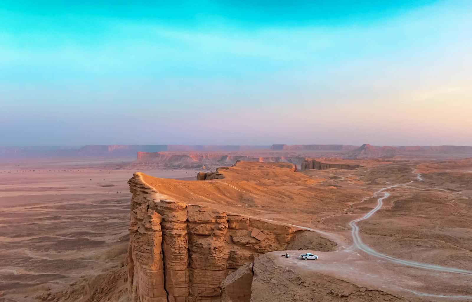 Stunning desert landscape at Edge of the World in Riyadh, Saudi Arabia during sunset.