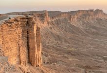 brown rock formation under white sky during daytime